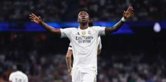 Vini Jr. renova com Real Madrid até 2032 e afasta Arsenal Vinícius Júnior em campo com a camisa do Real Madrid durante partida